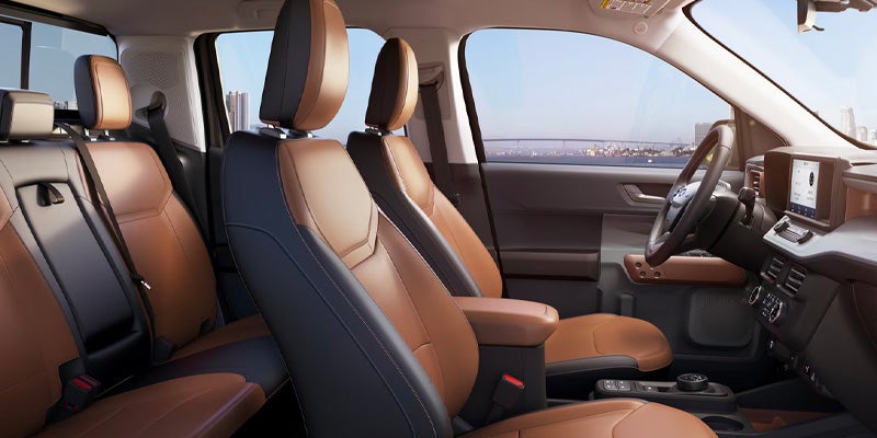 interior of a 2025 Ford Maverick truck with two-tone black and tan leather seats